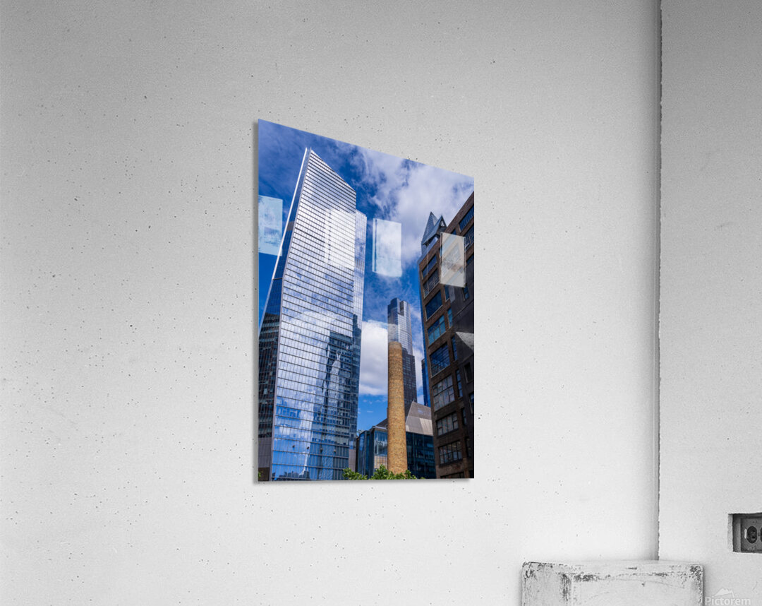 Looking up at modern buildings by brick chimney in Hudson Yards Acrylic Print