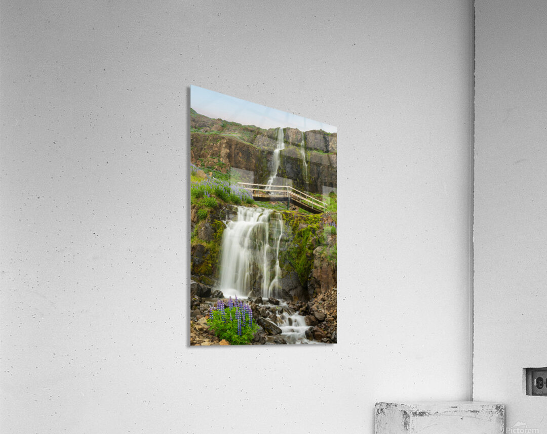 Budareyrarfoss waterfall cascades down the mountain by the port  Acrylic Print