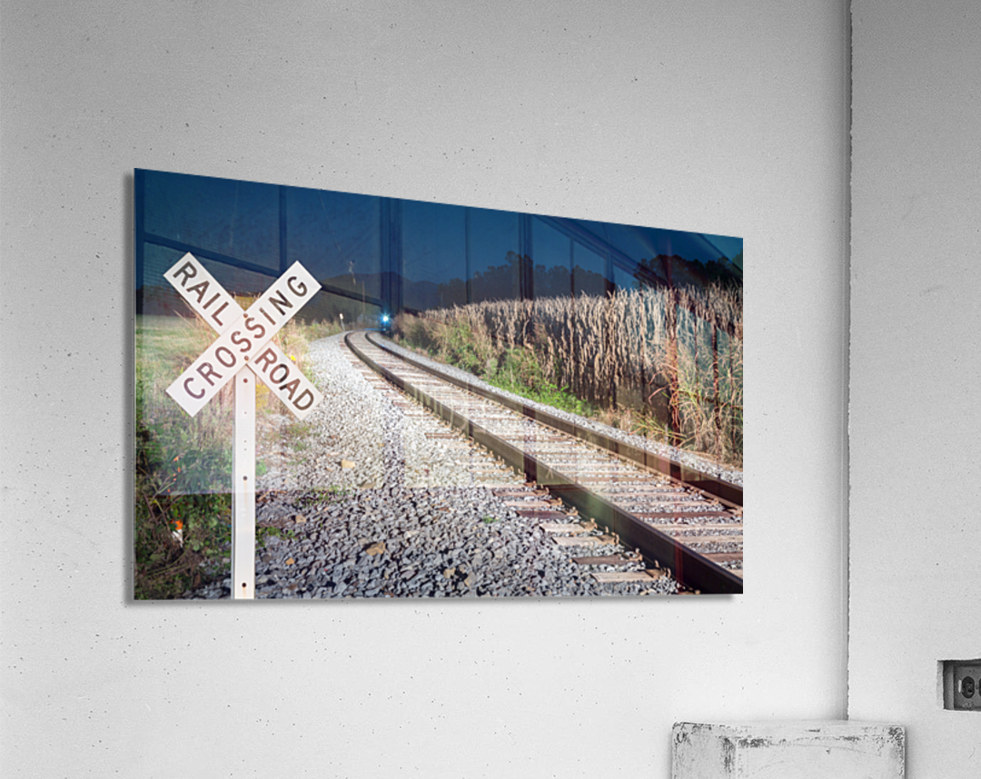 Oncoming train with railroad crossing sign  Acrylic Print 