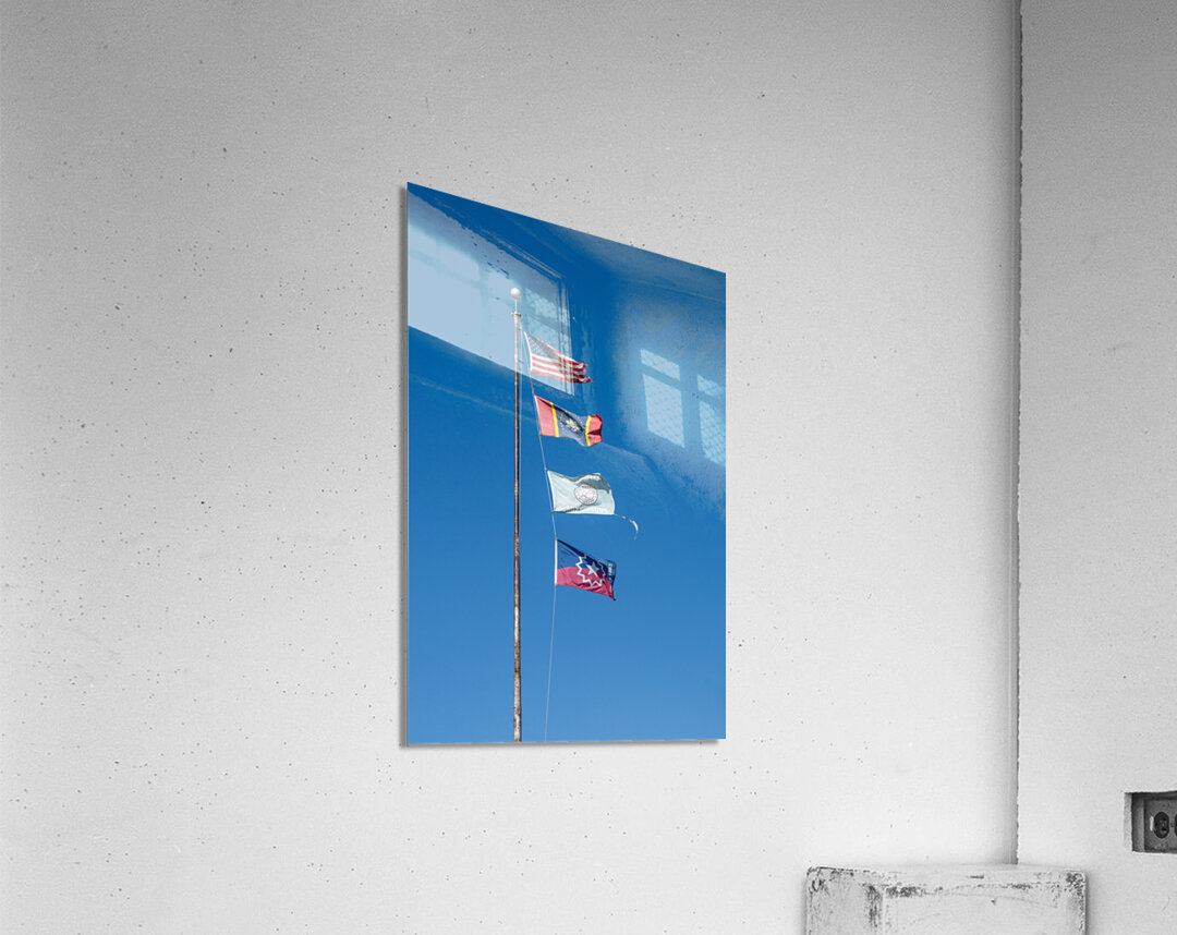 Flagpole with multiple flags in the small town of Greenville MS Acrylic Print