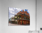 Traditional wrought iron balcony on ochre New Orleans house  Acrylic Print