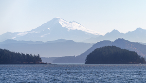Shades of blue with Mt Baker in misty distance through Obstructi