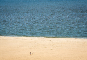 Single couple on wide beach at Cape May Point
