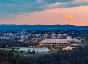 Super pink moon rises above the WVU coliseum on Evansdale campus