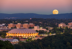 Moon rising above the Coliseum at WVU