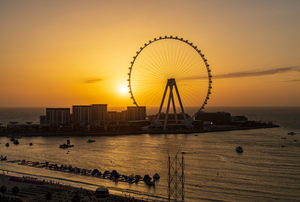 Sunset behind Ain Dubai observation wheel on Bluewaters Island