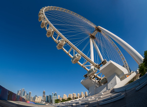 Fisheye view of Ain Dubai observation wheel with JBR in backgrou