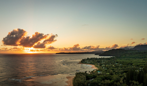 Broad panorama of sunrise over Tunnels Beach Kauai Hawaii