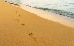 Early morning footsteps on Tunnels Beach on Kauai in Hawaii