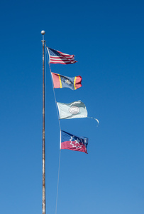 Flagpole with multiple flags in the small town of Greenville MS