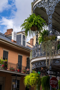 Traditional wrought iron balcony on brick New Orleans house