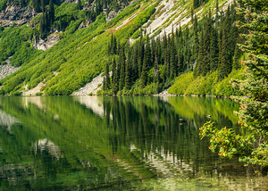 Mirror image reflection of Rainy Lake in North Cascades National