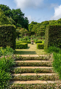 Stone steps into a hedged flower garden on the Isle of Wight