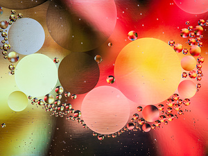 Oil and water reflecting dramatic colors