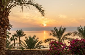 Sun setting behind the West Bank of Israel over Dead Sea