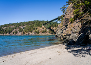 Turbulent water of Deception Pass under historic cantilevered br