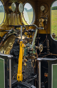 Detail of the driver cabin and controls on an old steam locomoti