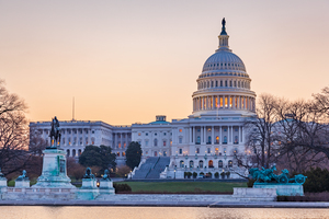 Sunrise behind the dome of the Capitol