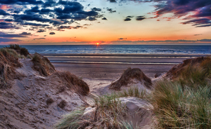Sunset over Formby Beach through dunes