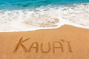 Kauai written in sandy beach