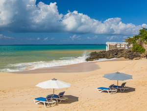 Reclining chairs and umbrella on Baie Rouge