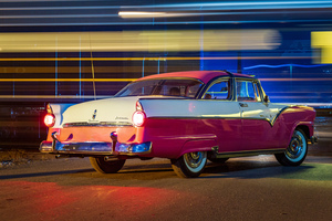 Vintage car at railroad crossing