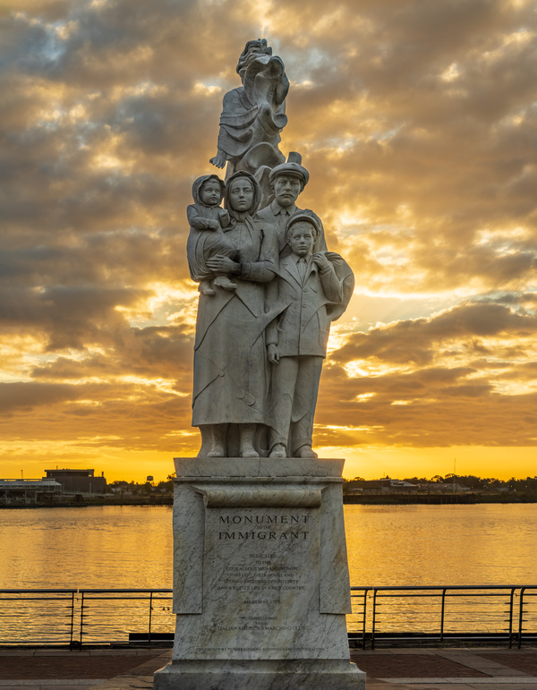 Monument to the Immigrant sculpture in New Orleans at sunrise by Steve Heap