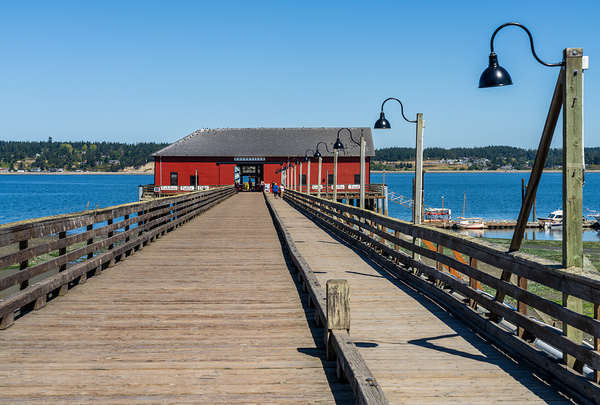 Wooden pier leading to famous red Coupeville wharf on Whidbey Is Print
