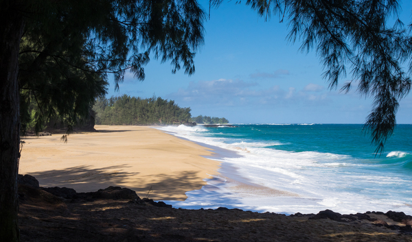 Powerful waves flow onto sand at Lumahai Beach Kauai by Steve Heap