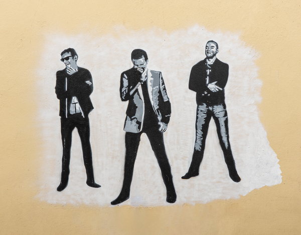 Wall painting of the pop group Muse  by Steve Heap