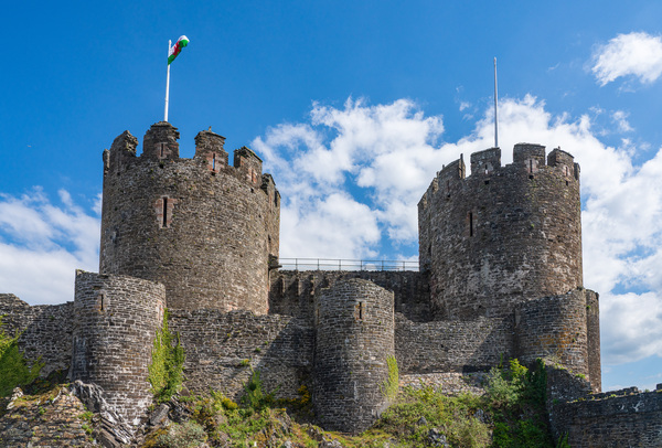 Flag flies over the historic Conwy castle in North Wales by Steve Heap