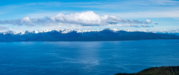 Broad panorama of the mountain range at Icy Strait Point in Alas by Steve Heap
