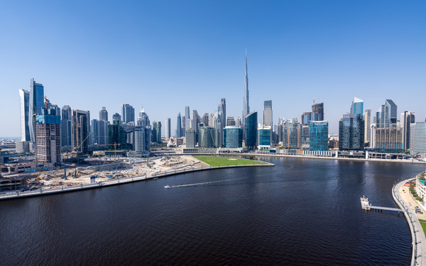 Offices and apartments of Dubai Business Bay with district behin by Steve Heap