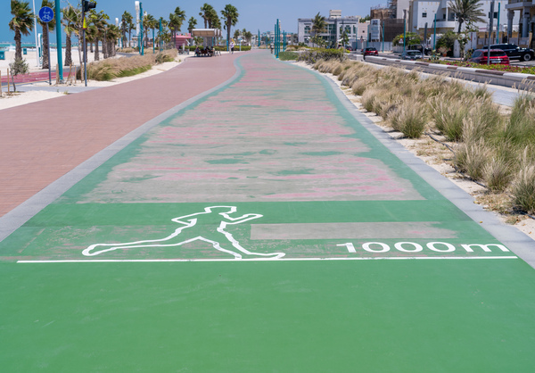 Rubber surface of running track alongside Dubai beach by Steve Heap