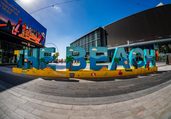 Colorful The Beach sign on main street of JBR district of Dubai by Steve Heap