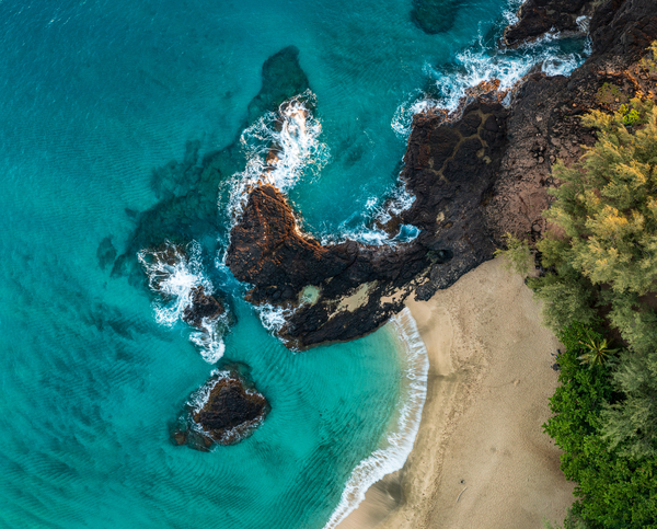 Top down view of rocks and waves on Lumahai beach Kauai by Steve Heap