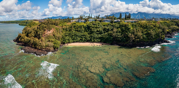 Aerial view of Sealodge beach in Princeville on Kauai by Steve Heap