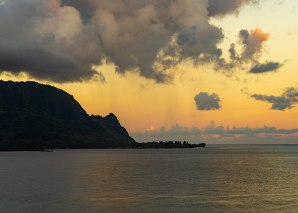 Sunrise over Hanalei bay with silhouette of north shore peaks by Steve Heap