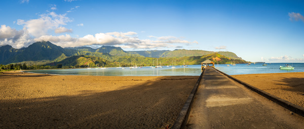 Panorama of the sandy beach and Hanalei Pier at sunrise by Steve Heap
