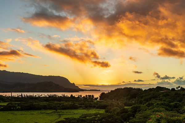 Sunset over Hanalei bay from overlook on the road by Steve Heap