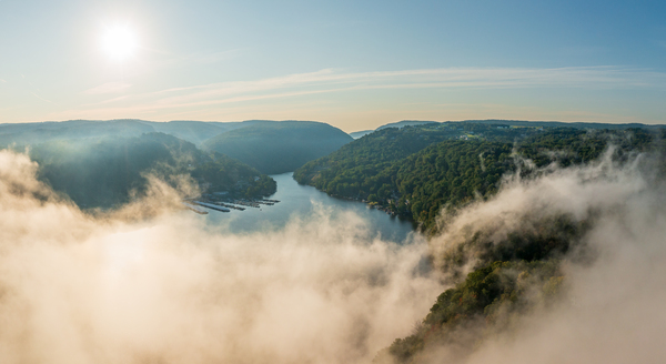Mist rises from Cheat Lake in the early morning as the sun rises by Steve Heap