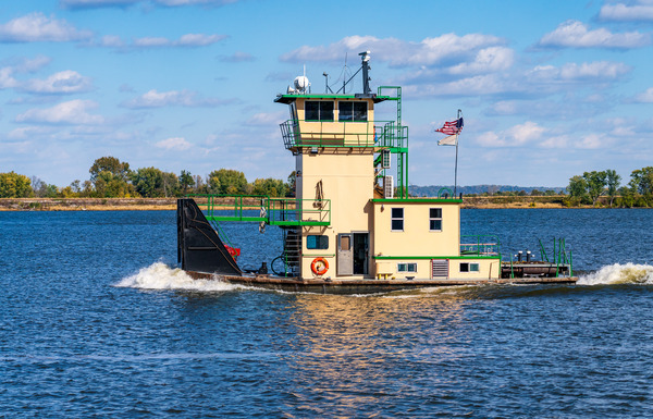 Tug boat or pusher boat leaving Lock and Dam 22 on Mississippi r by Steve Heap