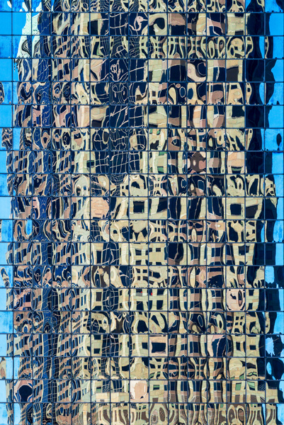 Complex reflections of a modern skyscraper in St Louis  by Steve Heap