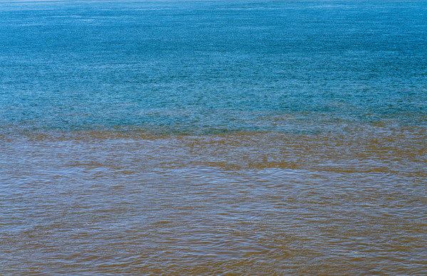 Blue clear water from Ohio river meets brown muddy Mississippi by Steve Heap