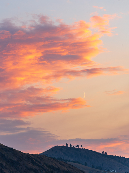 Fiery sunset clouds enveloping the new crescent moon over Lake C by Steve Heap