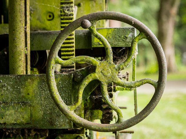Moss covered farm machinery with handle by Steve Heap