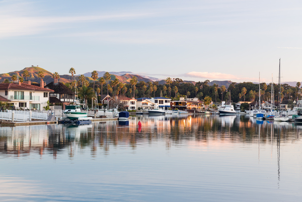 Sunrise over homes and boats ventura by Steve Heap