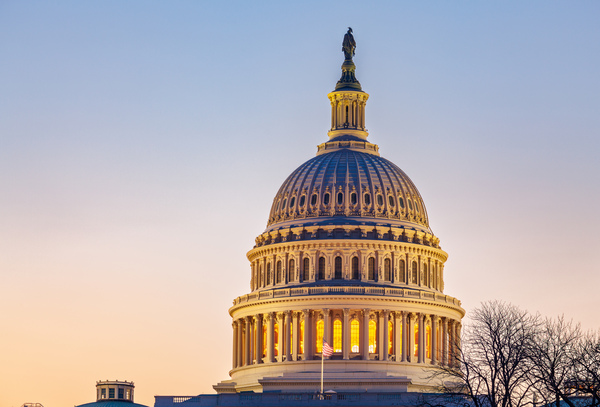 Sunrise behind the dome of the Capitol Print