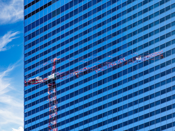 Reflection of crane in Chicago windows by Steve Heap
