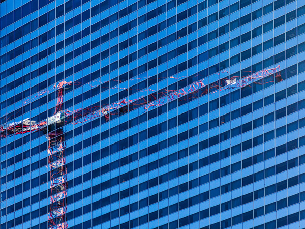 Reflection of crane in Chicago windows by Steve Heap
